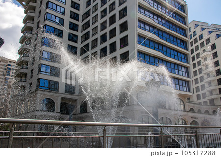 High jets of water fountain in the city 105317288