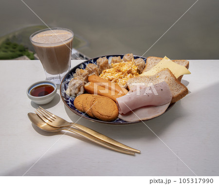 Breakfast is including Breads, Fried sausages, Ham, Pork shumais, Scrambled eggs, Cheese, Crispy ginger cookies and Honey served with Protein Shake. Breakfast is including Breads, Fried sausages, Ham, Pork shumais, Scrambled eggs, Cheese, Crispy ginger cookies and Honey served with Protein Shake. 105317990