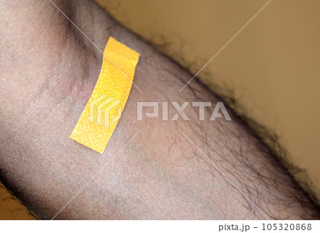 Plaster on human skin 105320868