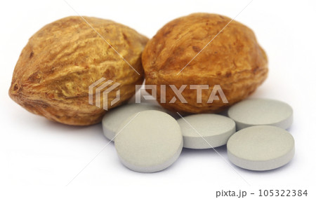 Medicinal Haritaki fruits with tablets Medicinal Haritaki fruits with tablets 105322384