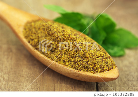 Grated mustard seeds with green herbs 105322888