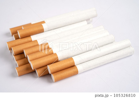 Cigarette, tobacco in roll paper with filter tube, No smoking concept. Cigarette, tobacco in roll paper with filter tube, No smoking concept. 105326810