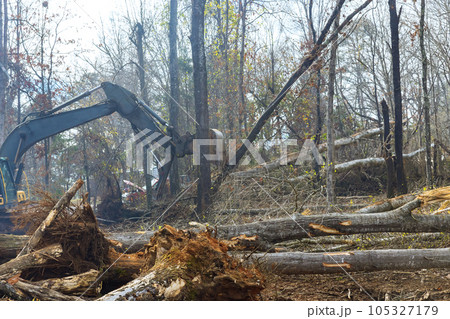 With help of an excavator, worker is getting ground ready for house construction. With help of an excavator, worker is getting ground ready for house construction. 105327179