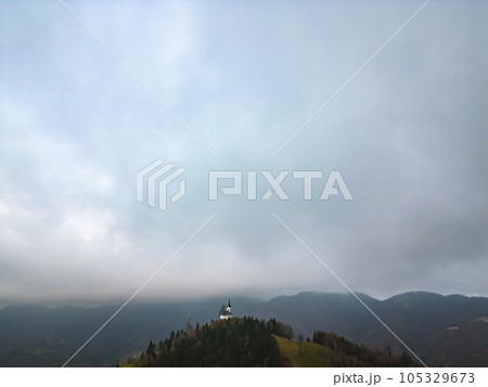 Aerial view of a church on top of st. Jakob hill above Medvode 105329673