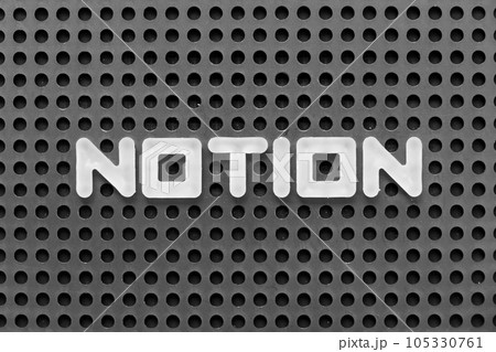 White alphabet letter in word notion on black pegboard background 105330761