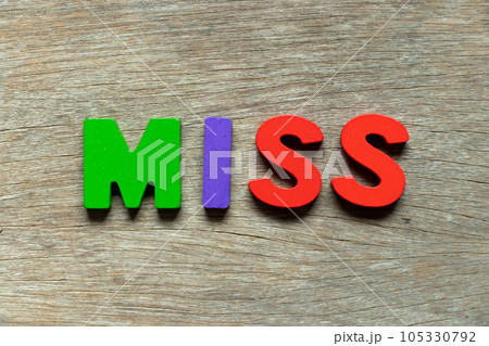 Color alphabet letter in word miss on wood background 105330792
