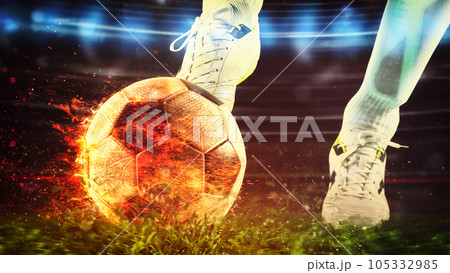 Close up of a soccer scene with player kicking a fiery ball with power 105332985
