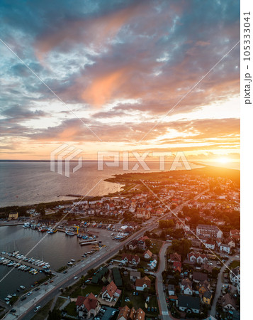 beautiful sunset at Jastarnia town, Poland, Hel peninsula, aerial drone view beautiful sunset at Jastarnia town, Poland, Hel peninsula, aerial drone view 105333041