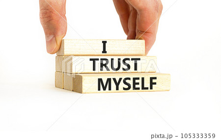 I trust myself symbol. Concept words I trust myself on wooden blocks. Businessman hand. Beautiful white table white background. Business, psychological and I trust myself concept. Copy space. I trust myself symbol. Concept words I trust myself on wooden blocks. Businessman hand. Beautiful white table white background. Business, psychological and I trust myself concept. Copy space. 105333359
