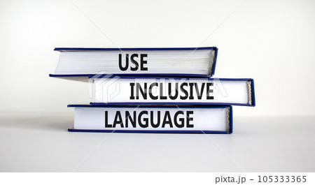 Use inclusive language symbol. Books with words 'Use inclusive language' on beautiful white table, white background. Business and use inclusive language concept. Copy space. 105333365