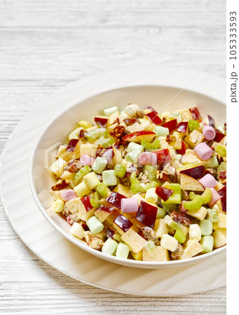 Sweet Apple Salad with celery, marshmallows, pecan 105333593