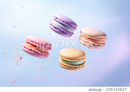 Macaroons in motion falling. Sweet colorful french macaroons levitation in the air. Generative AI 105333827