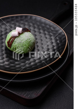 Delicious sweet colorful mochi desserts or ice cream with rice dough and toppings Delicious sweet colorful mochi desserts or ice cream with rice dough and toppings 105335484