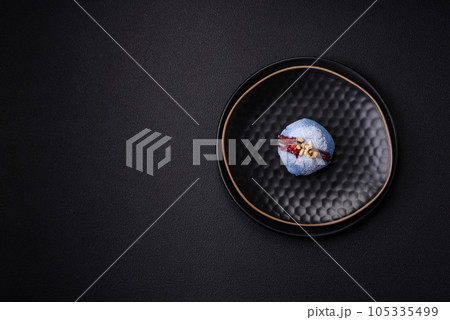 Delicious sweet colorful mochi desserts or ice cream with rice dough and toppings Delicious sweet colorful mochi desserts or ice cream with rice dough and toppings 105335499