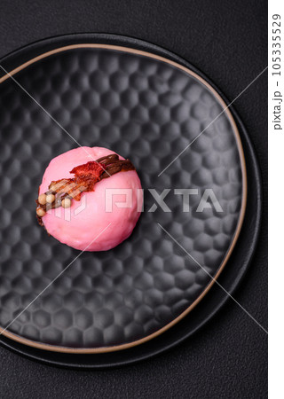 Delicious sweet colorful mochi desserts or ice cream with rice dough and toppings Delicious sweet colorful mochi desserts or ice cream with rice dough and toppings 105335529