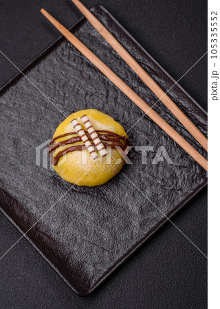 Delicious sweet colorful mochi desserts or ice cream with rice dough and toppings 105335552