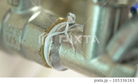 Threaded connection of plumbing pipes with FUM tape sealing Threaded connection of plumbing pipes with FUM tape sealing 105336163