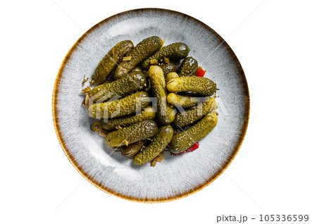 Plate with Pickled gherkins cucumbers on wooden board. High quality Isolate, white background. Plate with Pickled gherkins cucumbers on wooden board. High quality Isolate, white background. 105336599