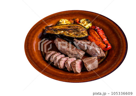 Grilled mutton tenderloin Fillet Meat, lamb sirloin on rustic plate with vegetables. High quality Isolate, white background. Grilled mutton tenderloin Fillet Meat, lamb sirloin on rustic plate with vegetables. High quality Isolate, white background. 105336609
