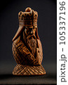 Roughly carved wood figurine of a chess king 105337196