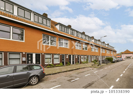 an empty street with cars parked on the side and houses in the background, taken from the car's perspective an empty street with cars parked on the side and houses in the background, taken from the car's perspective 105338390