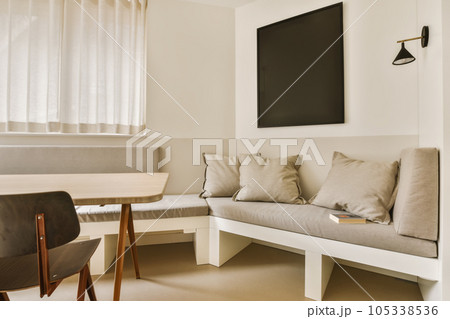 a living room with a couch, table and tv mounted on the wall in it's centerpieces a living room with a couch, table and tv mounted on the wall in it's centerpieces 105338536