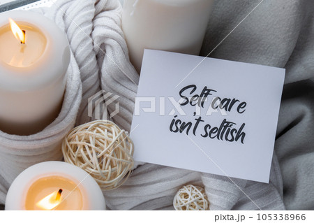 SELF CARE ISNT SELFISH text saying phrase on paper note on background of Home fragnance concept autumn holidays at cozy home. Still life of micro moment candid slow living. Mental health wellbeing SELF CARE ISNT SELFISH text saying phrase on paper note on background of Home fragnance concept autumn holidays at cozy home. Still life of micro moment candid slow living. Mental health wellbeing 105338966