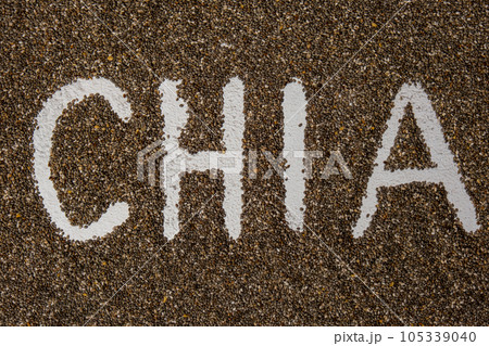 Word CHIA seeds background. Healthy superfood rich in Omega 3 fatty acids. Dry healthy natural ingredient. Vegetarian food favorite dietary Word CHIA seeds background. Healthy superfood rich in Omega 3 fatty acids. Dry healthy natural ingredient. Vegetarian food favorite dietary 105339040