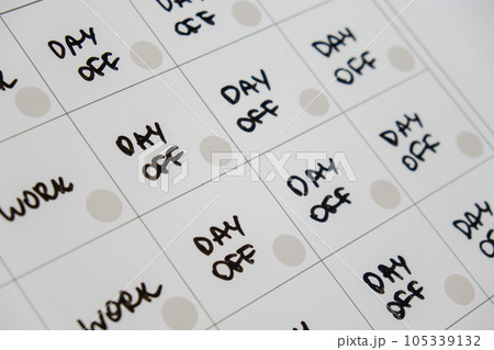 Magnetic board writing 4 day work week calendar with three weekend days off four day working week concept. Modern approach doing business short workweek. Effectiveness of employees. Productivity and 105339132