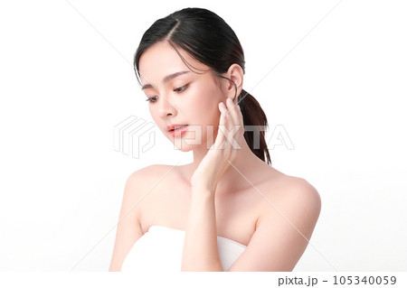 Beautiful young asian woman with clean fresh skin on white background, Face care, Facial treatment, Cosmetology, beauty and spa, Asian women portrait. Beautiful young asian woman with clean fresh skin on white background, Face care, Facial treatment, Cosmetology, beauty and spa, Asian women portrait. 105340059