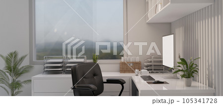 A modern white office room with a computer mockup on a white corner table against the window 105341728