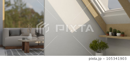 Empty white mockup wall in a minimal living room with a skylight window, indoor plants Empty white mockup wall in a minimal living room with a skylight window, indoor plants 105341903