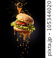 A burger, piled high with juicy beef, melted cheese, crisp lettuce, and tangy pickles. 105344020