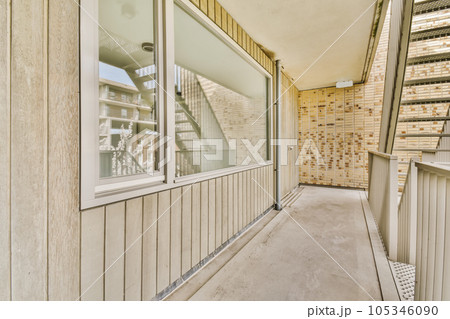 an outside area that is very clean and has no people on it or any other place to see the reflection in the window an outside area that is very clean and has no people on it or any other place to see the reflection in the window 105346090