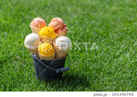 Assorted ice cream flavours in delightful waffle cones 105346708