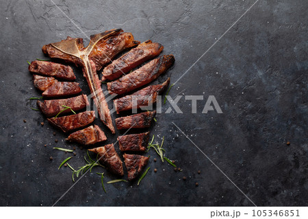 Grilled porterhouse beef steak. Sliced T-bone Grilled porterhouse beef steak. Sliced T-bone 105346851