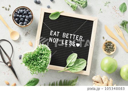 Eat better not less letter board quote flat lay 105348083