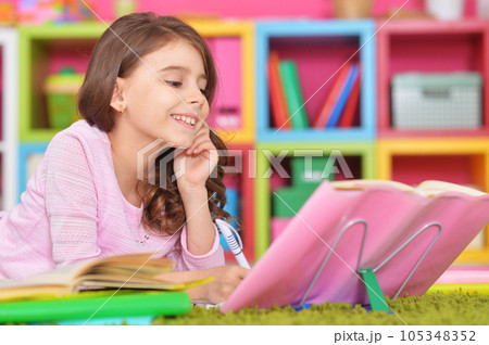 schoolgirl doing homework 105348352