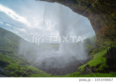 Seljalandsfoss waterfall in summer season in Iceland. Famous nature landscape background Seljalandsfoss waterfall in summer season in Iceland. Famous nature landscape background 105349667