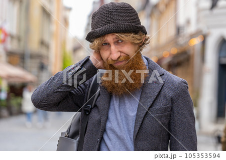 Sad unhappy frustrated young man walking alone in city street, feeling bad annoyed, grief problem Sad unhappy frustrated young man walking alone in city street, feeling bad annoyed, grief problem 105353594