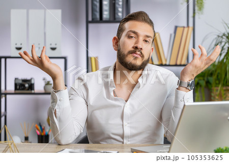 Confused businessman embarrassed about ambiguous question, having doubts, no answer idea, clueless 105353625