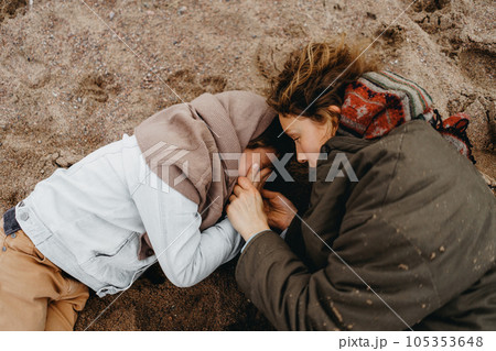 Mother and son quarrel. Kid covered his face with hands and cries 105353648