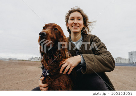Portrait of a young happy woman with her dog 105353655