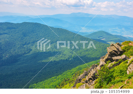 carpathian watershed ridge. stones and boulders on the green grassy hills. hot summer day. location pikui mountain, ukraine 105354999