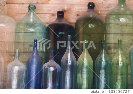 Glass multi-colored wine bottles dusty Glass multi-colored wine bottles dusty 105356727