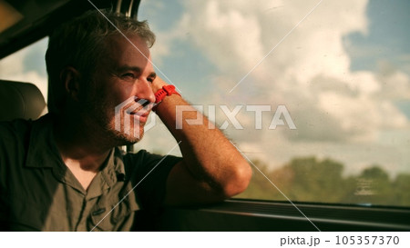 Happy and confident handsome man travels by train 105357370