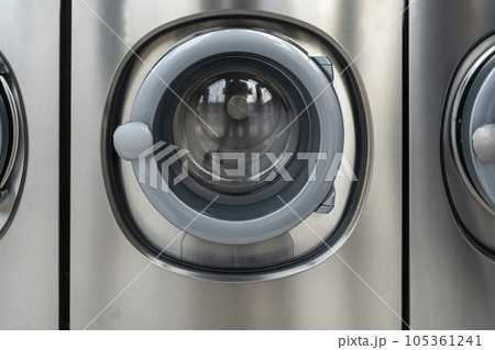 Laundromat Service, Line of Laundry Machines, Commercial Laundrette, Public Launderette Washer Laundromat Service, Line of Laundry Machines, Commercial Laundrette, Public Launderette Washer 105361241