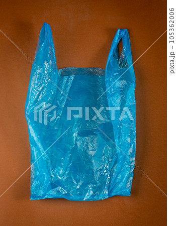 Blue Plastic Bags on Brown Background, Crumpled Plastic Bag after Shopping, Cellophane Packaging Waste Blue Plastic Bags on Brown Background, Crumpled Plastic Bag after Shopping, Cellophane Packaging Waste 105362006