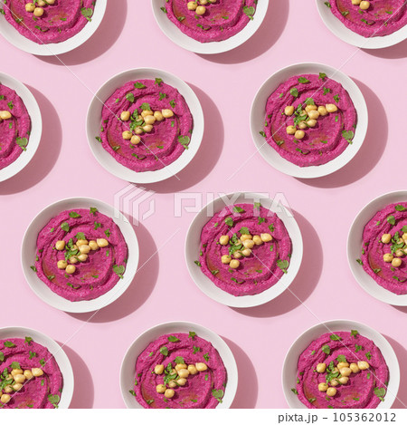Pattern with beetroot hummus on pink background, top view 105362012