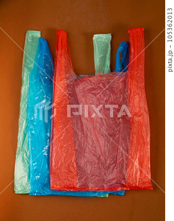 Many Plastic Bags on Brown Background. Crumpled Plastic Bag after Shopping, Cellophane Packaging Waste 105362013
